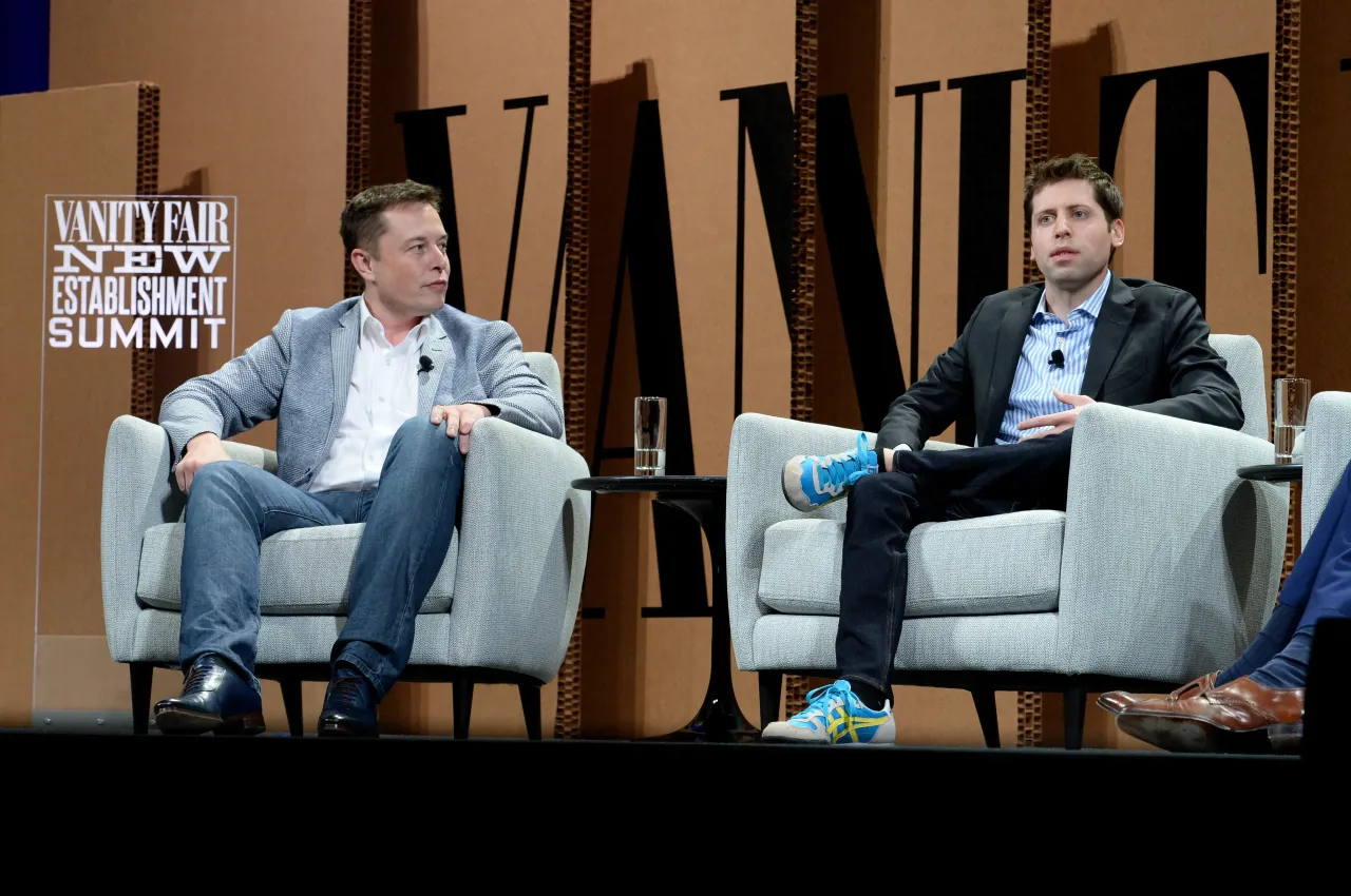 Elon Musk and Sam Altman speaking during an event on October 6, 2015 in San Francisco, California. (Photo by Michael Kovac/Getty Images for Vanity Fair)