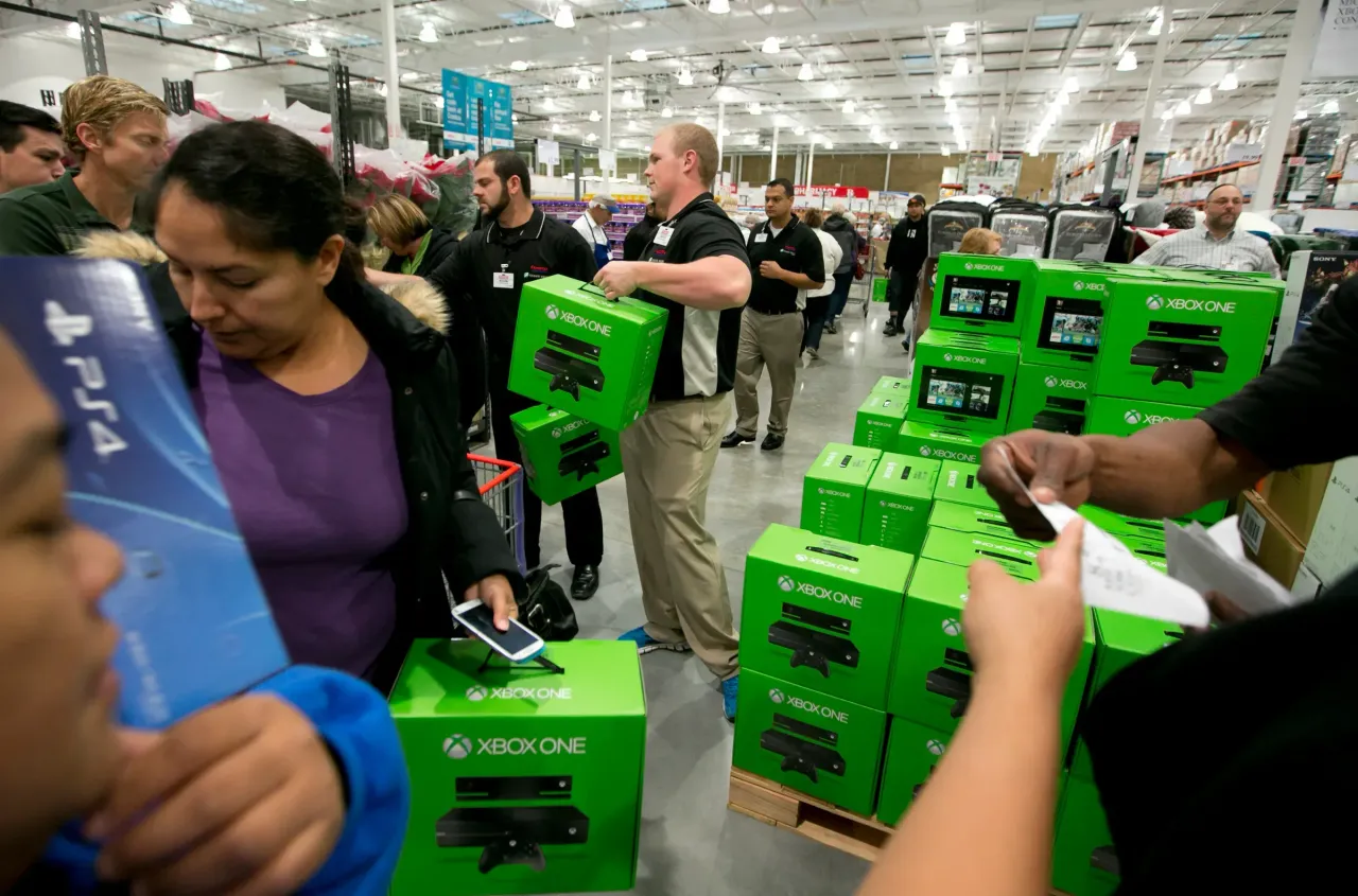 Shoppers reviewing Xbox One at a Costco store in Texas in November 2013. (Photo by Robert Daemmrich Photography Inc/Corbis via Getty Images)