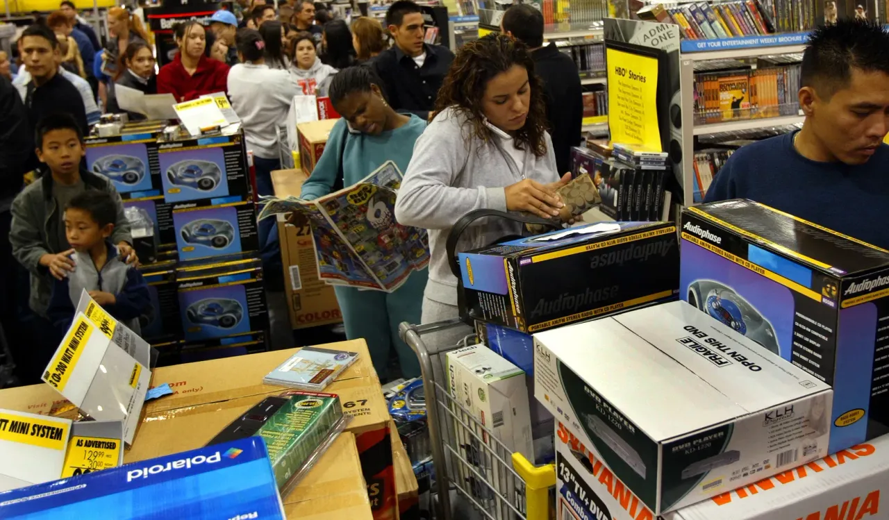 Shoppers wait in line to checkout at a Best Buy store in West Covina Friday. (Photo by Gina Ferazzi/Los Angeles Times via Getty Images)