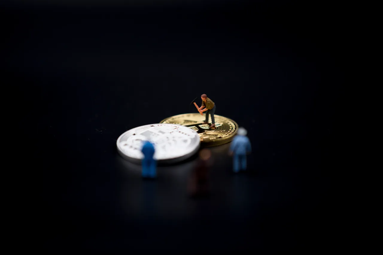 A view of Bitcoin token and a miner miniature figures. (Photo by Manuel Romano/NurPhoto via Getty Images)
