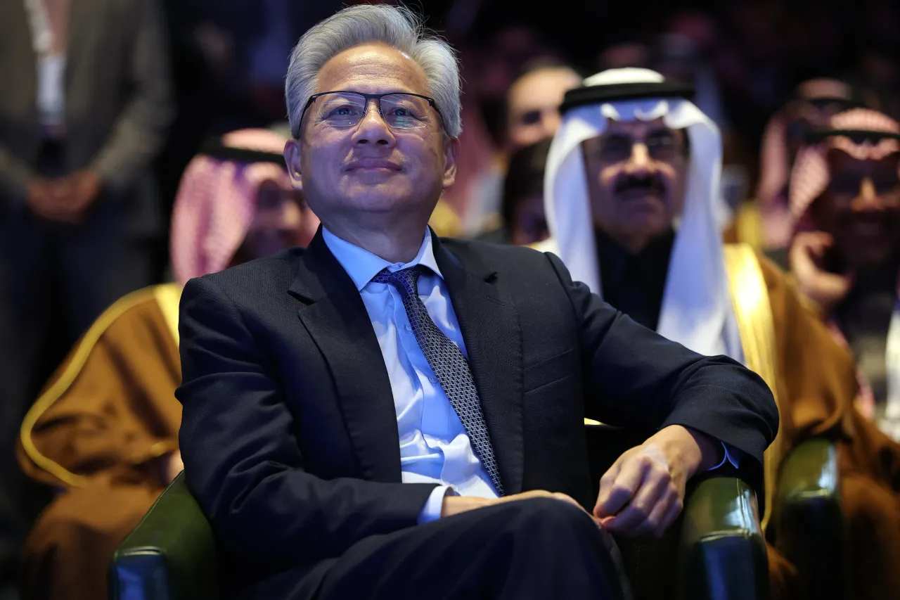 Nvidia CEO Jensen Huang listens as U.S. President Donald Trump delivers remarks at the U.S.-Saudi Investment Forum at the Kennedy Center on November 19, 2025 in Washington, DC. 