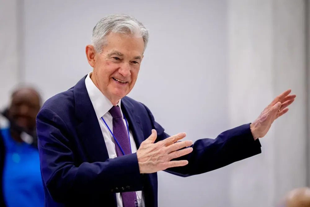 Federal Reserve Chair Jerome Powell talks to guests as he arrives to speak at the Thomas Laubach Research Conference held by the Federal Reserve Board of Governors on May 15, 2025 in Washington, DC. 