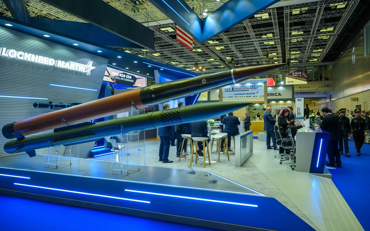 Attendees visit the Lockheed Martin pavilion during the Doha International Maritime Defence Exhibition and Conference 2026