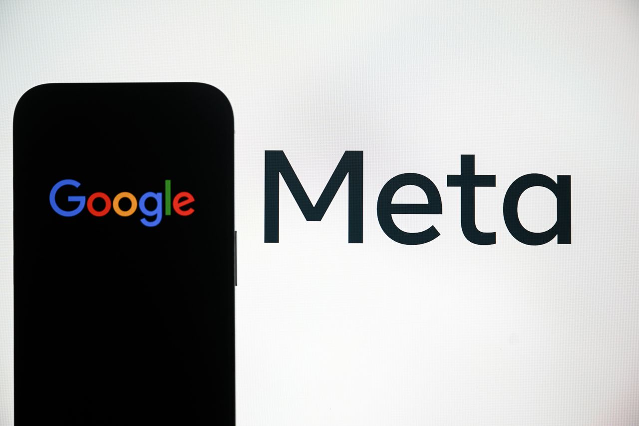 Google logo is being displayed on a mobile phone screen, in front of Meta logo. (Photo by Harun Ozalp /Anadolu via Getty Images)