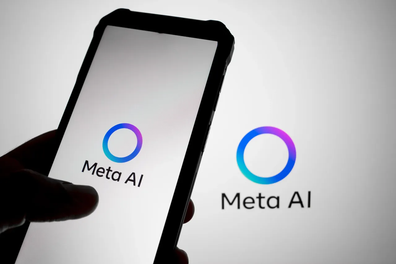 The Meta AI logo appears on a smartphone screen and as the background on a laptop screen in this photo illustration in Athens, Greece, on July 24, 2025. 