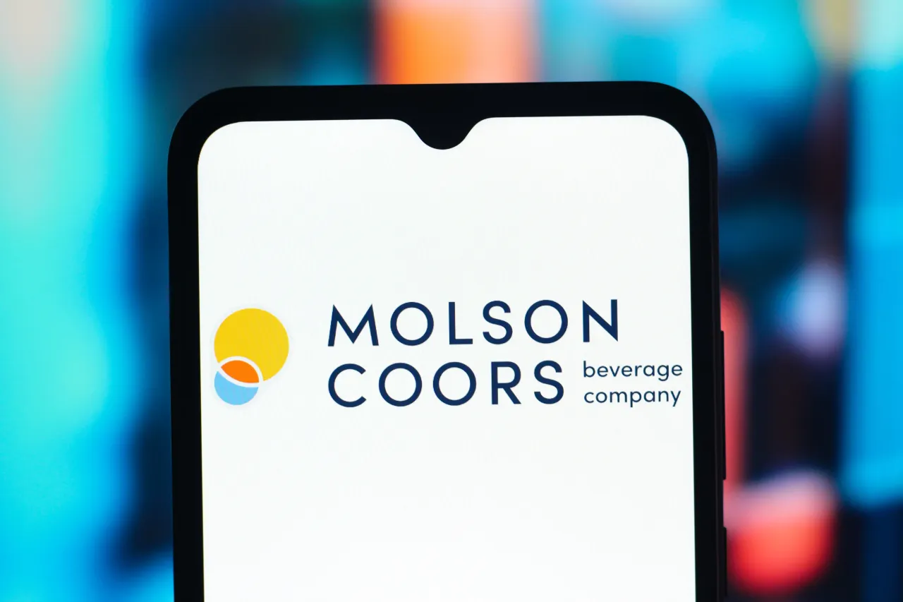 In this photo illustration, the Molson Coors Beverage logo is seen displayed on a smartphone screen.