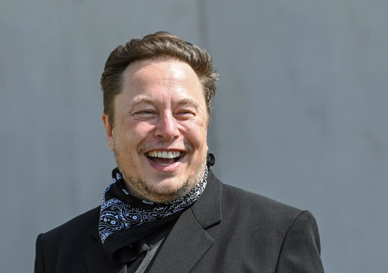 Elon Musk, Tesla CEO, stands at a press event on the grounds of the Tesla Gigafactory.
