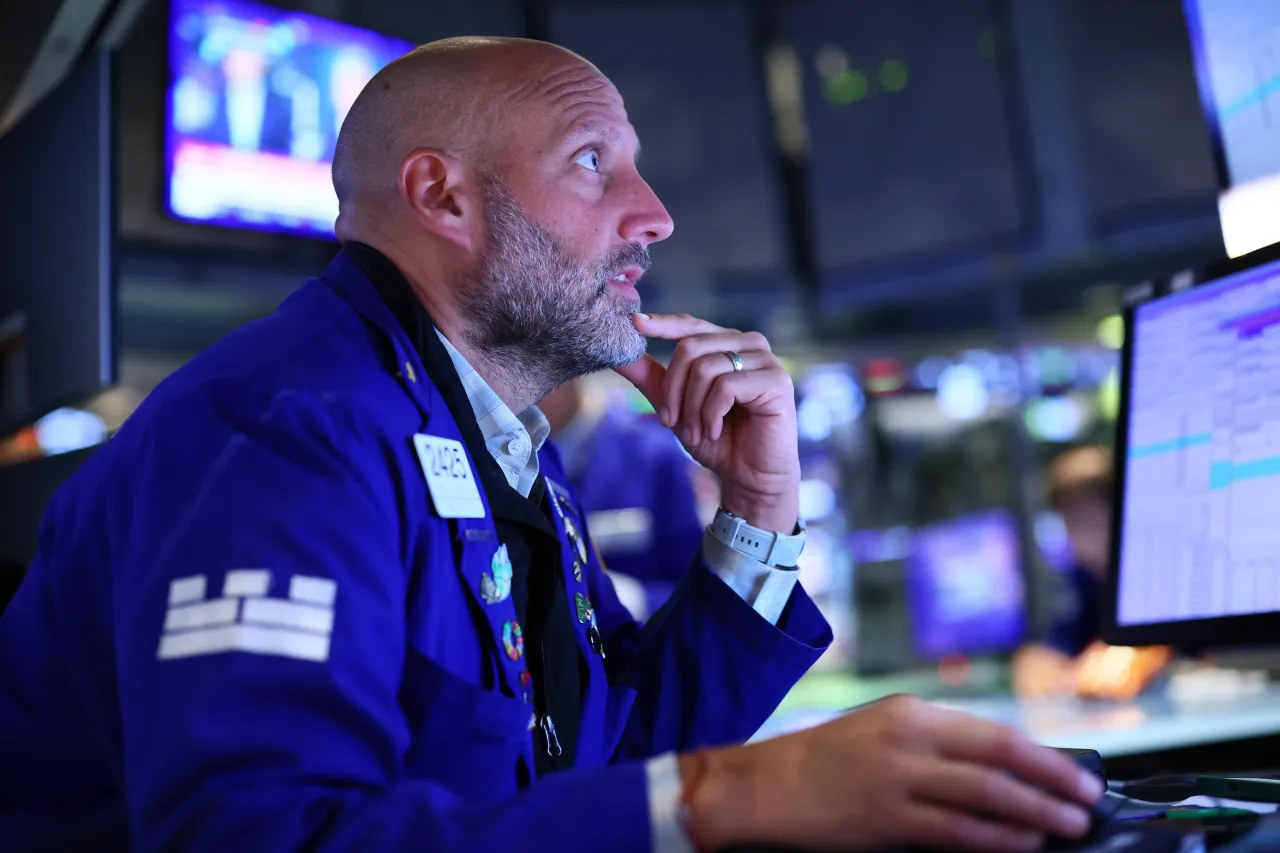 Traders work on the floor of the New York Stock Exchange during afternoon trading on August 01, 2025, in New York City. 