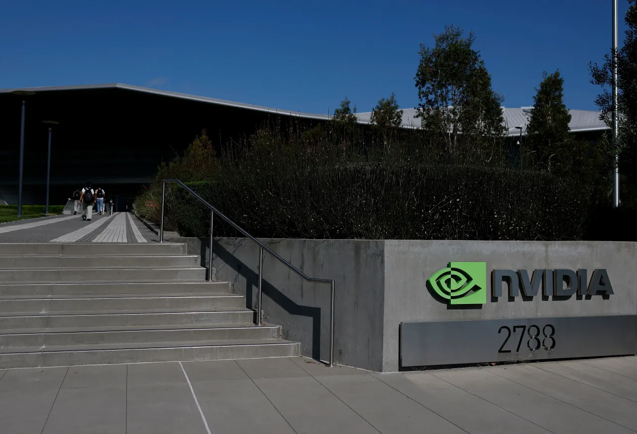 People enter a building at Nvidia headquarters on August 27, 2025 in Santa Clara, California. Chip maker Nvidia will report second-quarter earnings today after the closing bell. 