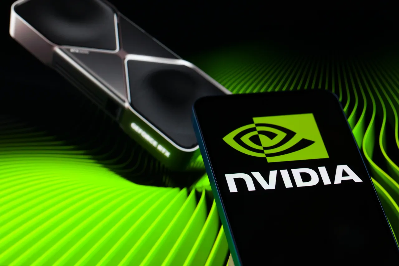 The NVIDIA logo is displayed on a mobile phone with a visual digital background in this photo illustration in Brussels, Belgium, on November 18, 2025.