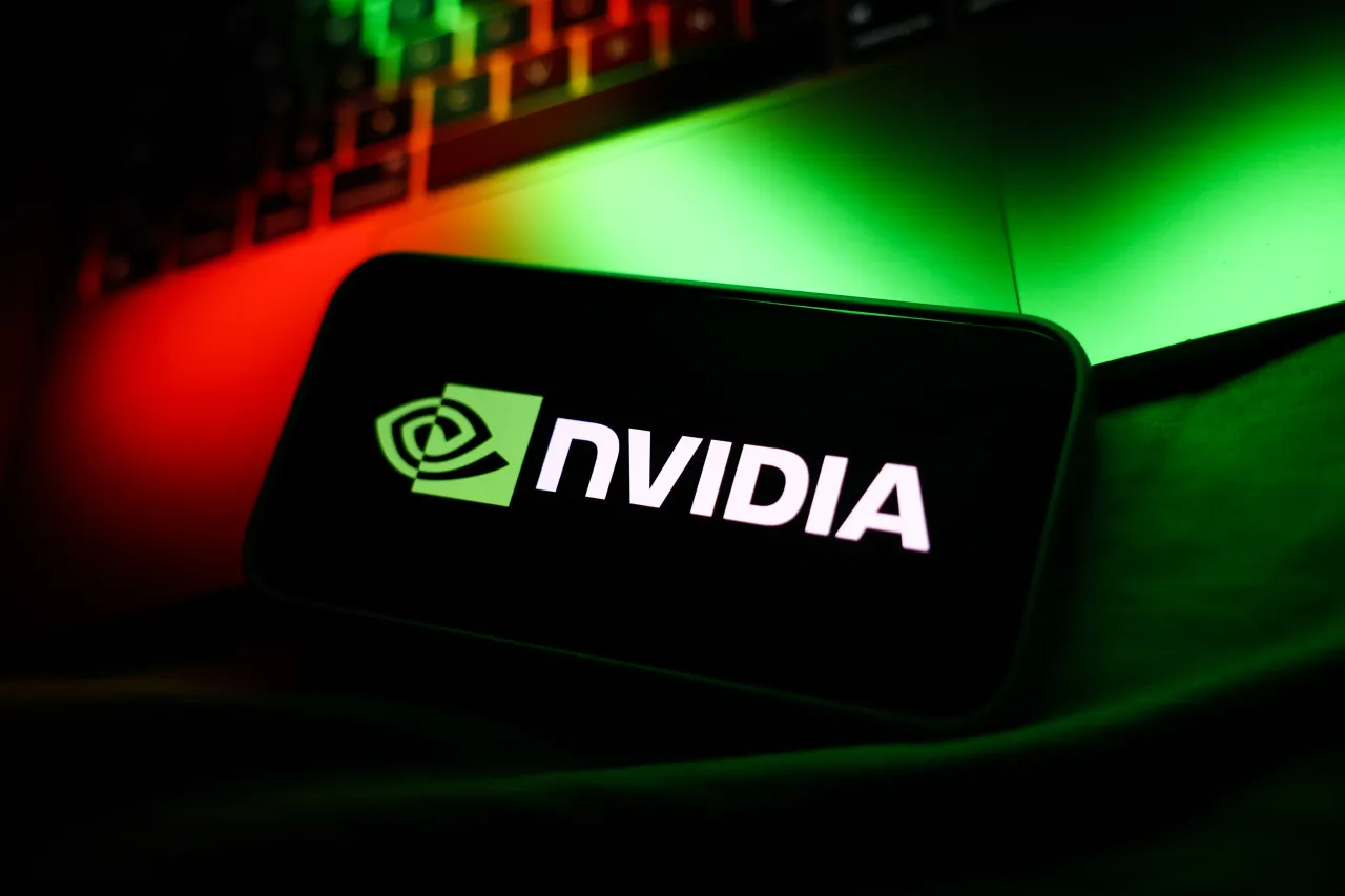 A laptop keyboard and Nvidia logo displayed on a phone screen are seen in this illustration photo taken in Krakow, Poland, on October 7, 2025. 