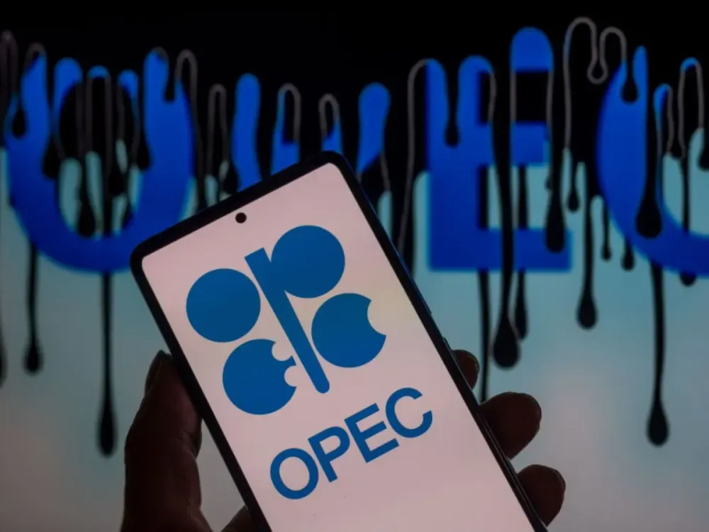 Opec logo displayed on a smart phone with Opec seen in the background, in this photo illustration. On 10 September 2023. In Brussels, Belgium. (Photo illustration by Jonathan Raa/NurPhoto via Getty Images)