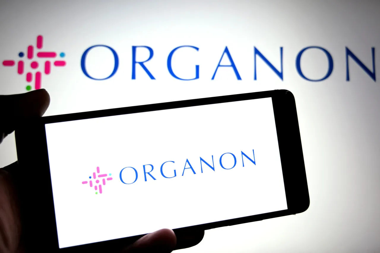 In this photo illustration, an ORGANON logo is seen displayed on a smartphone and in the background.