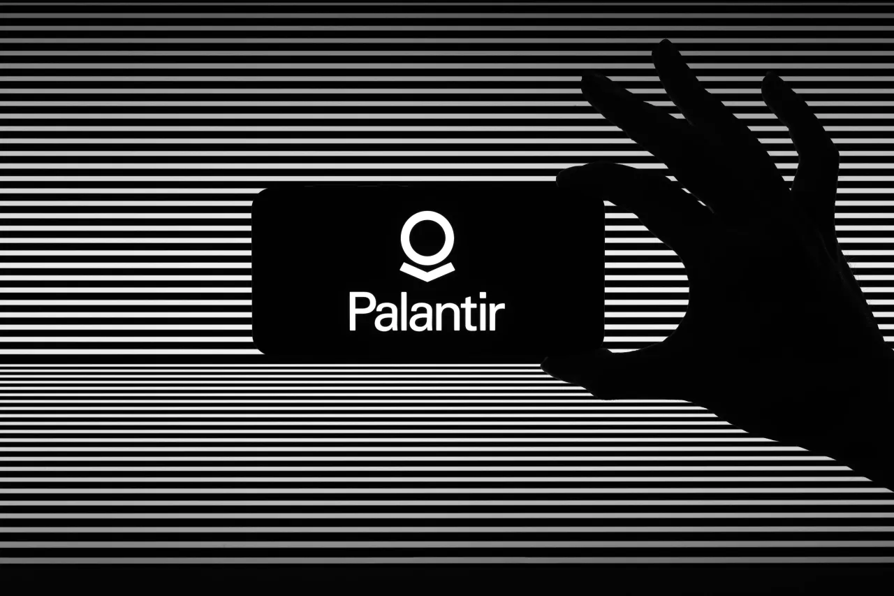 The Palantir Technologies logo is displayed on a mobile phone in this photo illustration in Brussels, Belgium, on August 6, 2025.