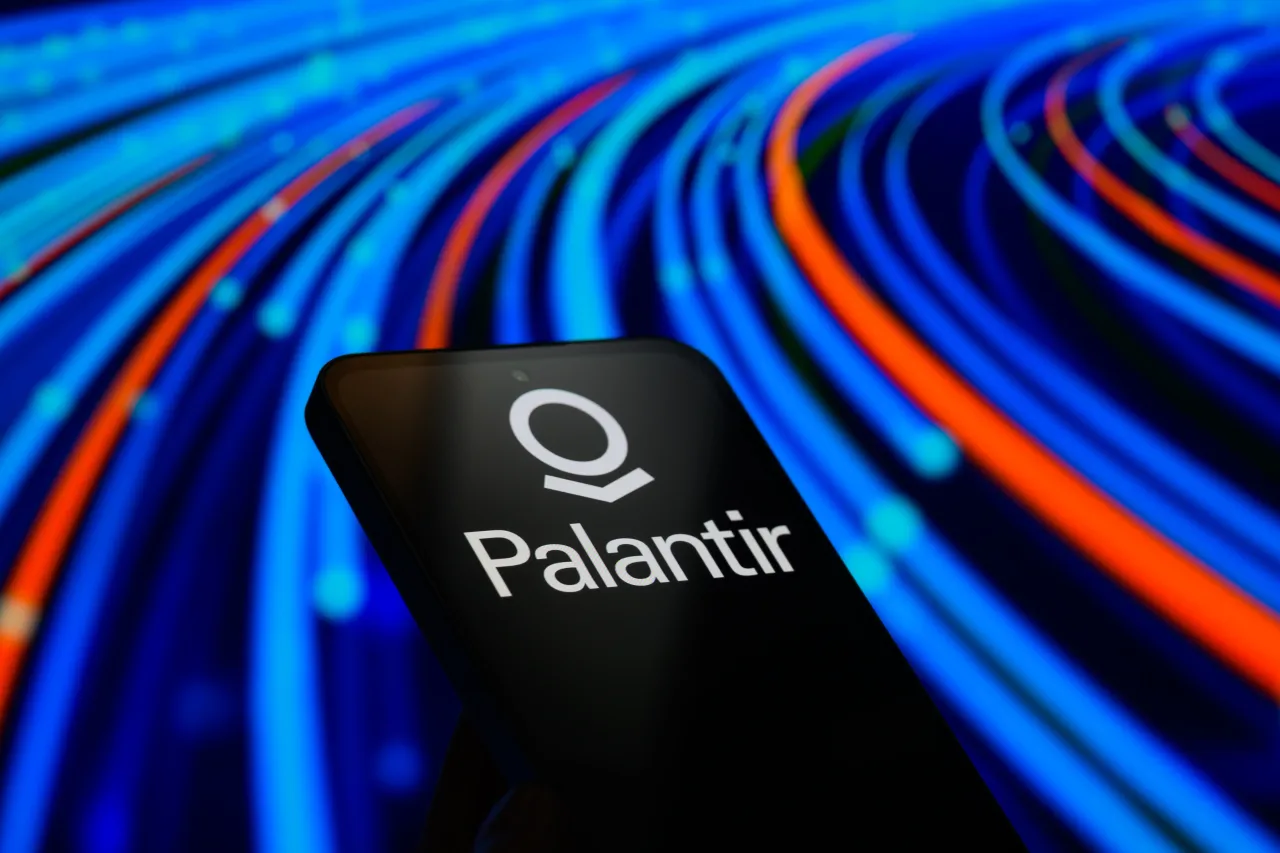 The Palantir Technologies logo is displayed on a mobile phone in this photo illustration in Brussels, Belgium, on August 6, 2025. (Photo by Jonathan Raa/NurPhoto via Getty Images)