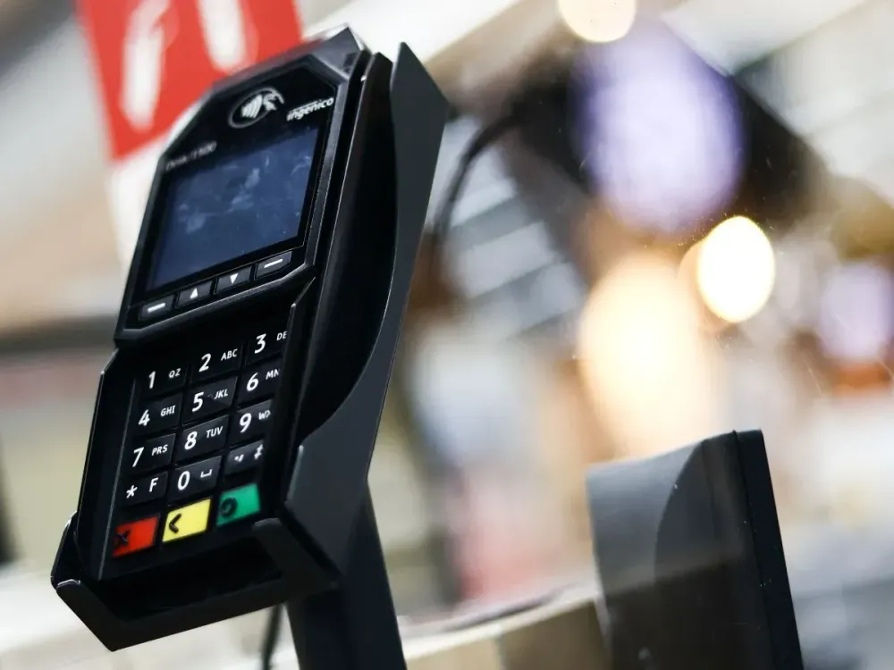 A payment terminal is seen at a store in Krakow, Poland on July 5, 2023. 