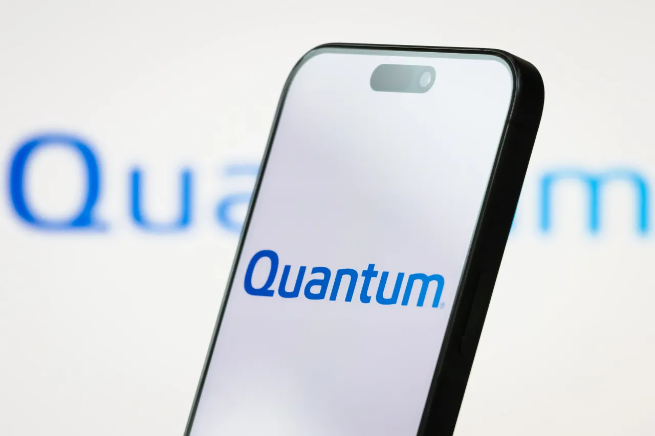 In this photo illustration, the logo of Quantum Corporation is displayed on a smartphone screen with a blurred version of the company's branding in the background on June 27, 2025 in Chongqing, China. 