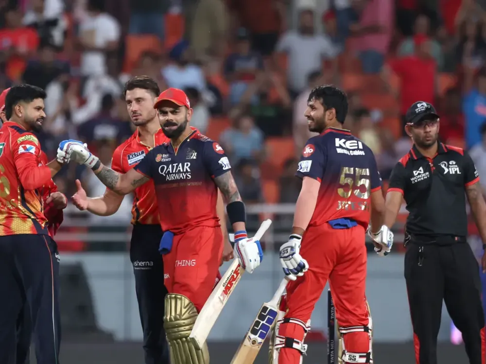 Virat Kohli and Jitesh Sharma of Royal Challengers Bengaluru celebrate their team's win over Punjab Kings during the 2025 IPL match between on April 20, 2025, in Mohali, India. (Photo by Pankaj Nangia/Getty Images)