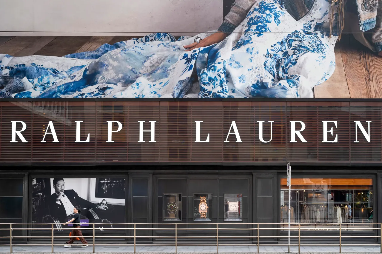 A pedestrian walks past the American fashion brand Ralph Lauren store in Hong Kong.