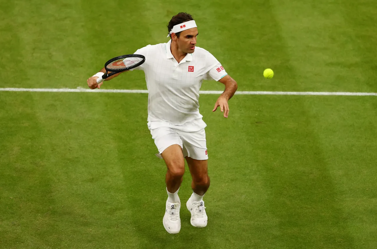 Roger Federer of Switzerland runs to return a shot in his Men's Singles Fourth Round match against Lorenzo Sonego of Italy during Day Seven of The Championships - Wimbledon 2021.