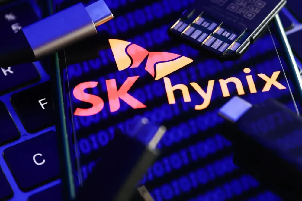 SK Hynix logo displayed on a phone screen with a binary code reflected on it in this illustration photo taken in Krakow, Poland on January 30, 2023. (Photo by Jakub Porzycki/NurPhoto via Getty Images)