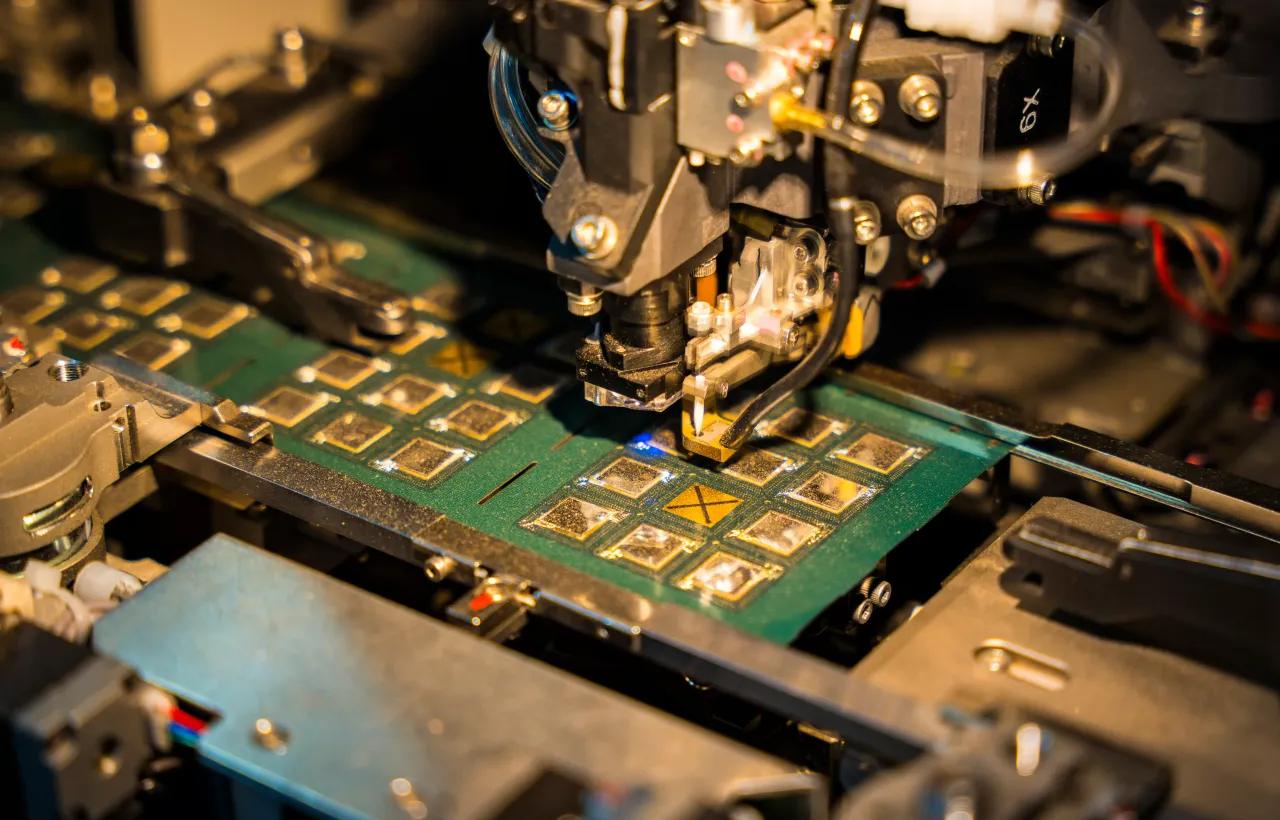 A robotic machine manufactures a semiconductor chip at a stall to show investors during The Advantage Assam 2.0 Investment Summit in Guwahati, India, on February 25, 2025. (Photo by David Talukdar/NurPhoto via Getty Images)