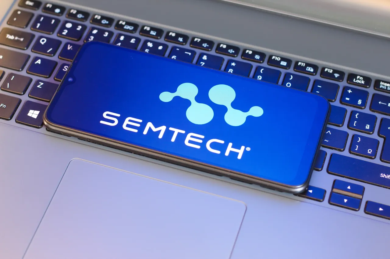  In this photo illustration, the Semtech Corporation logo is seen displayed on a smartphone screen next to a laptop keyboard. 