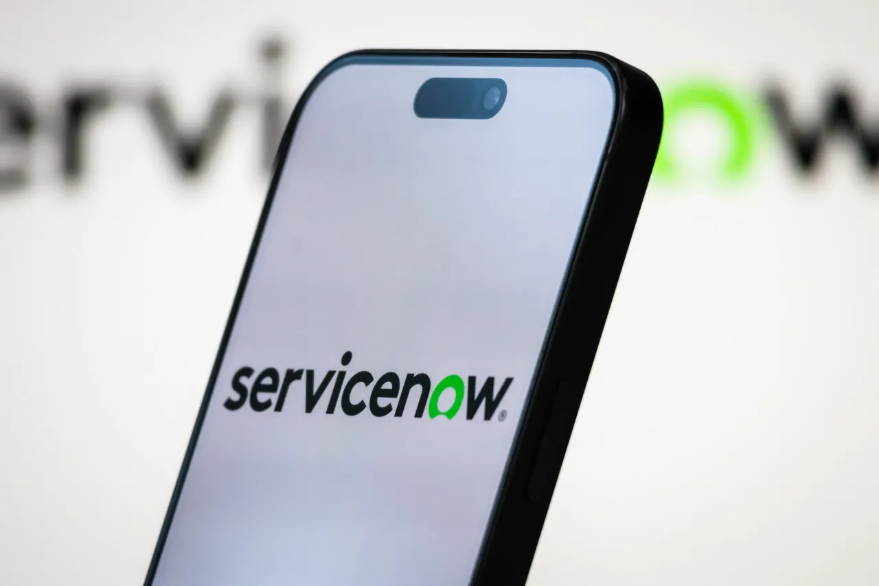 In this photo illustration, the logo of ServiceNow, Inc. is displayed on a smartphone screen, with the company's branding visible in the background, on April 20, 2025, in Chongqing, China.