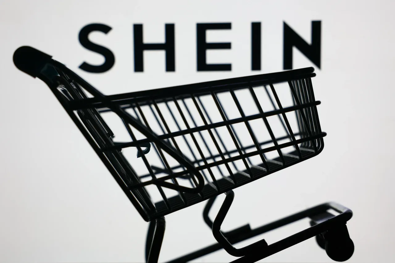 Shein logo on a screen and a small shopping cart are seen in this illustration photo taken in Krakow, Poland on June 8, 2025. 