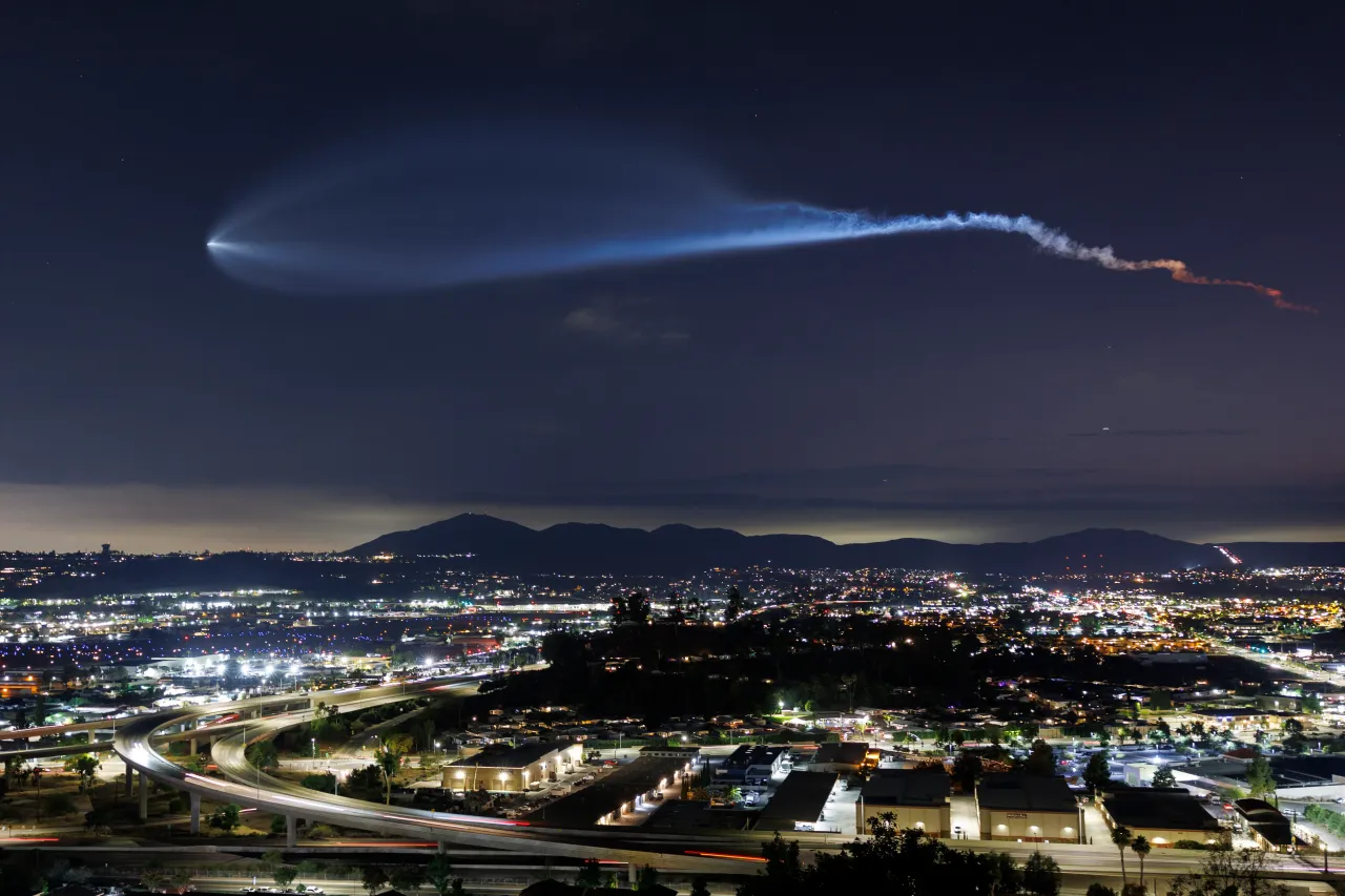 A SpaceX Falcon 9 rocket carrying a payload of 24 Starlink internet satellites soars into space after launching from Vandenberg Space Force Base on July 18, 2025, seen from Santee, California.