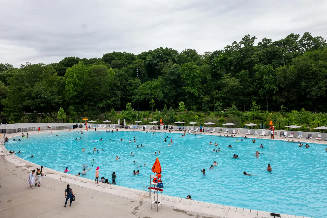 People swim in the newly opened Gottesman Pool at the Davis Center in Harlem Meer on the first day of the summer pool season in New York on June 27, 2025 in New York City.