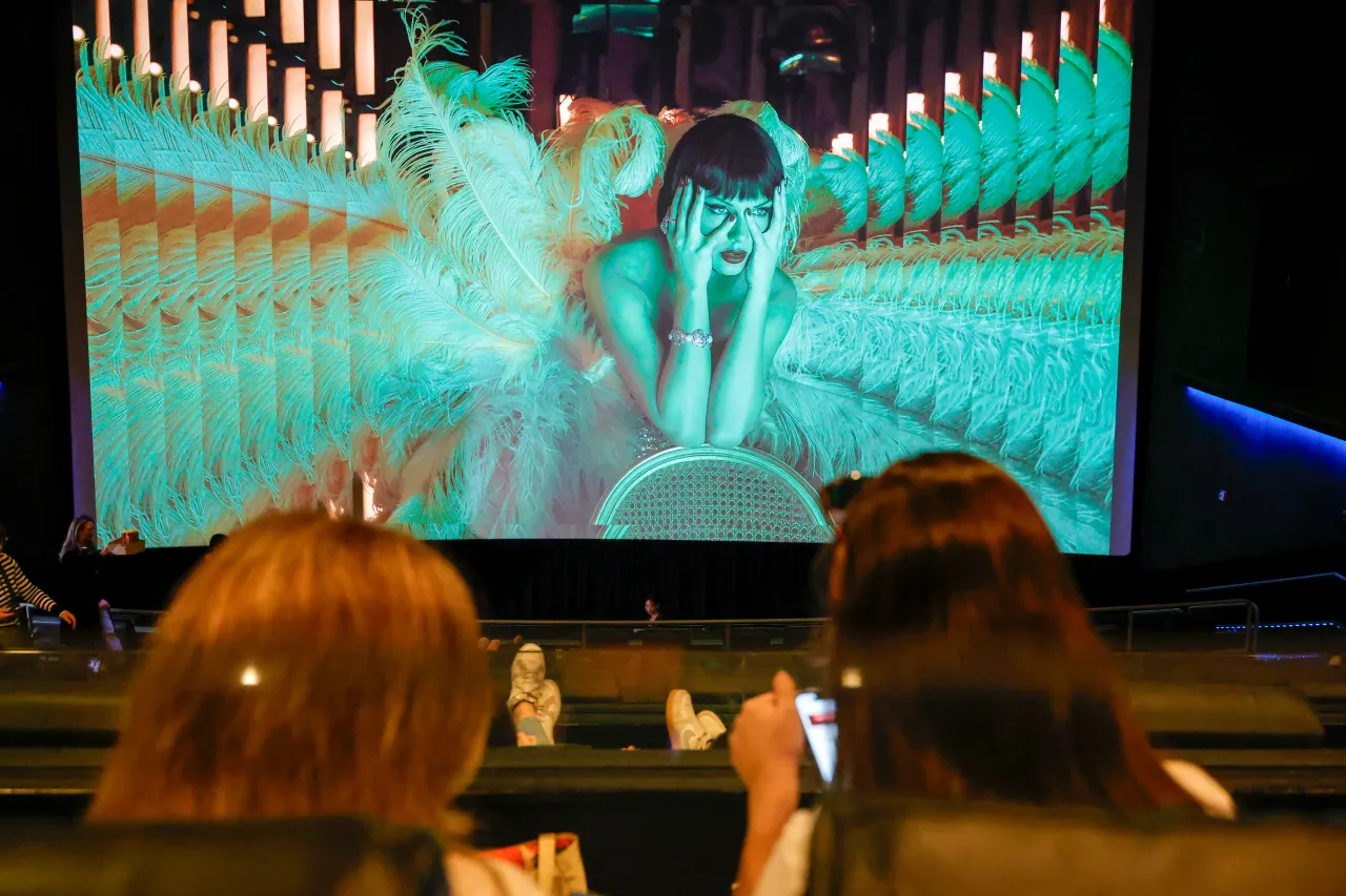 Audience members watch a film screening during Fans Celebrate Theatrical Release Of "Taylor Swift: The Official Release Party Of A Showgirl" at Westfield Century City on Oct. 03, 2025 in Los Angeles, California.