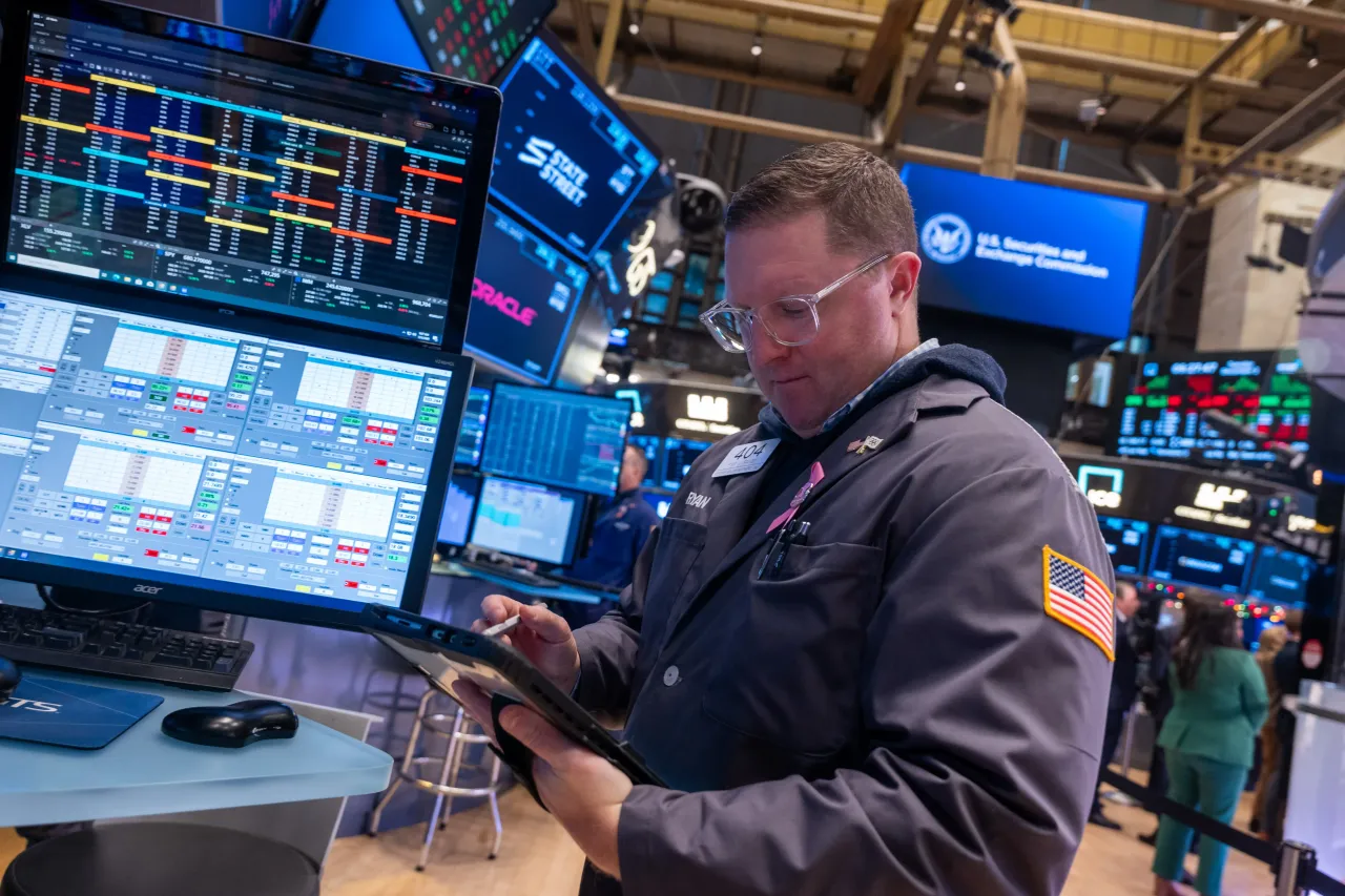 Traders work on the floor of the New York Stock Exchange (NYSE) on December 02, 2025 in New York City. After losing over 400 points on the first day of December, the market began to recover with the Dow up over 120 points in morning trading.