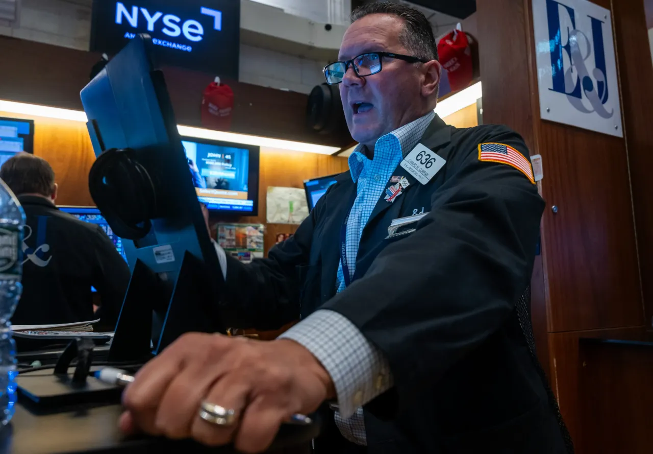 Traders work on the floor of the New York Stock Exchange (NYSE) on August 12, 2025 in New York City. 