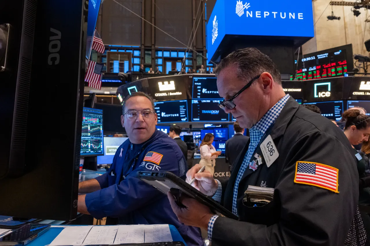 Traders work on the floor of the New York Stock Exchange (NYSE) on October 01, 2025, in New York City.