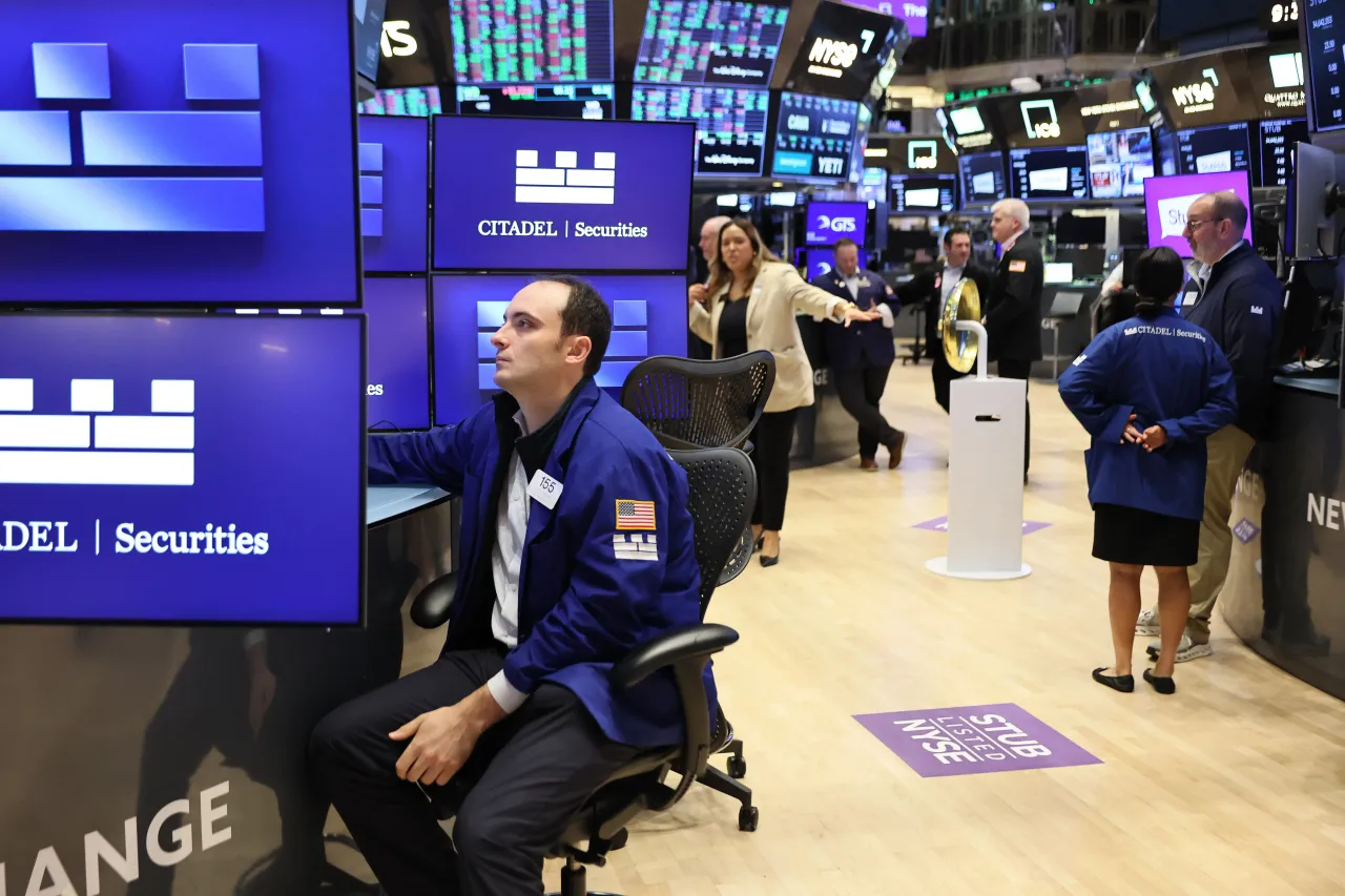 Traders work on the floor of the New York Stock Exchange during morning trading on September 17, 2025, in New York City. 