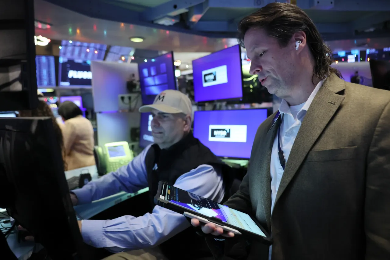 Traders work on the floor of the New York Stock Exchange during morning trading on December 10, 2025, in New York City, ahead of the Federal Reserve’s rate decision.