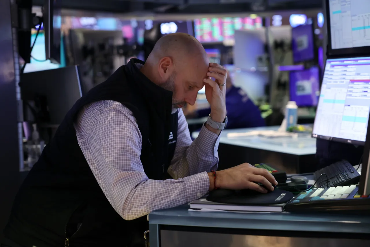 Traders work on the floor of the New York Stock Exchange (NYSE) on November 13, 2025 in New York City. 