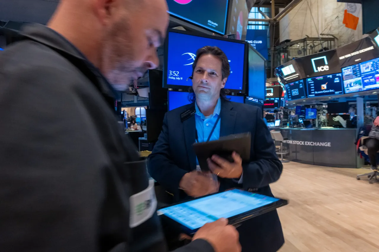 Traders work on the floor of the New York Stock Exchange (NYSE) on July 11, 2025, in New York City. As new tariffs continue to concern investors, the Dow fell over 250 points in trading Friday.