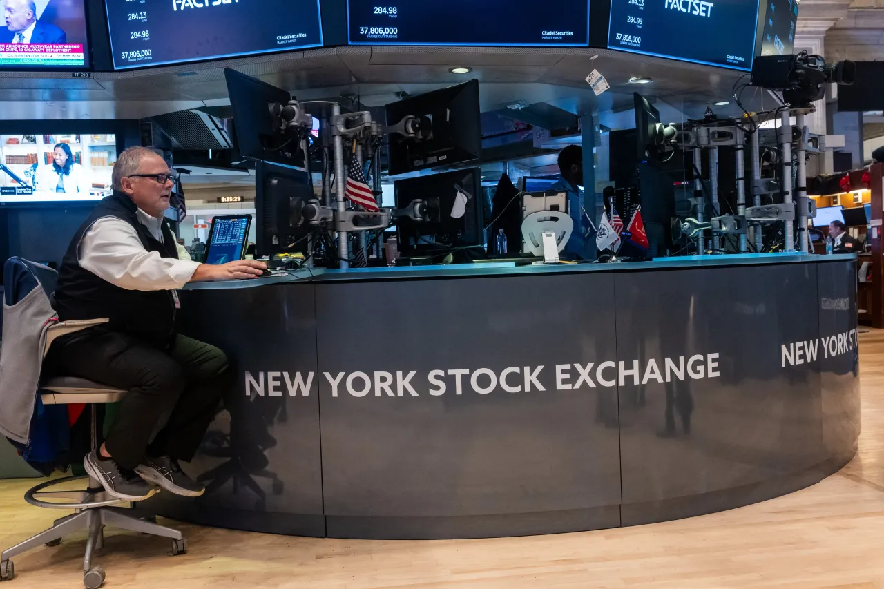 Traders work on the floor of the New York Stock Exchange (NYSE) on October 13, 2025, in New York City. 