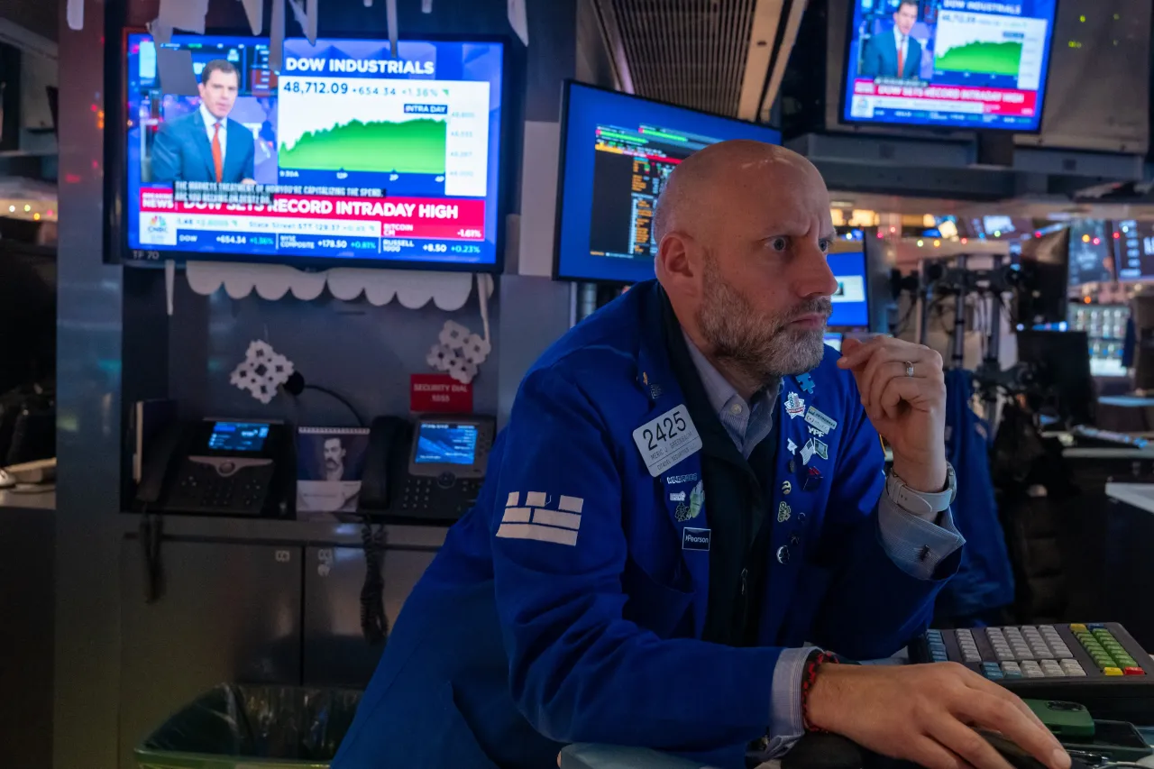 Traders work on the floor of the New York Stock Exchange (NYSE) on December 11, 2025, in New York City. 