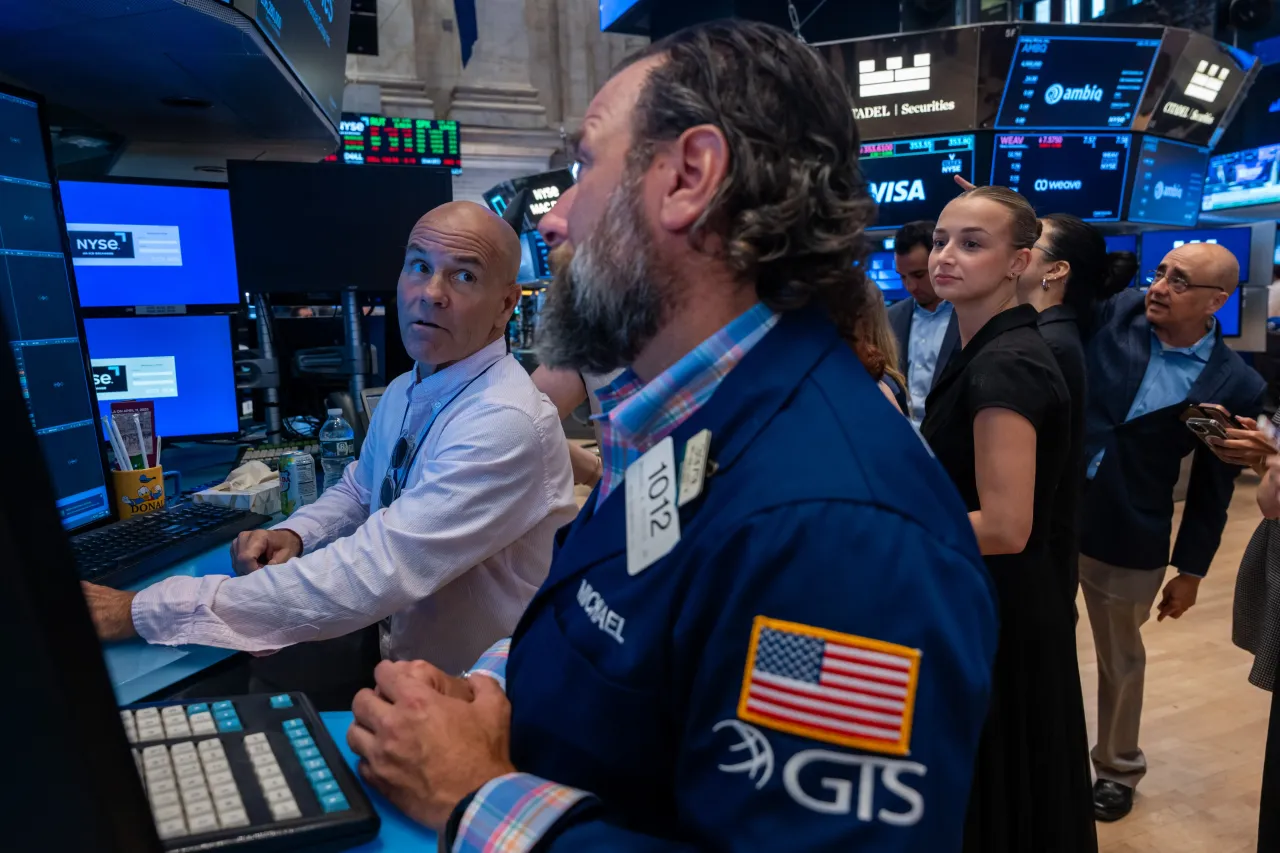 Traders work on the floor of the New York Stock Exchange (NYSE) on July 30, 2025, in New York City. 