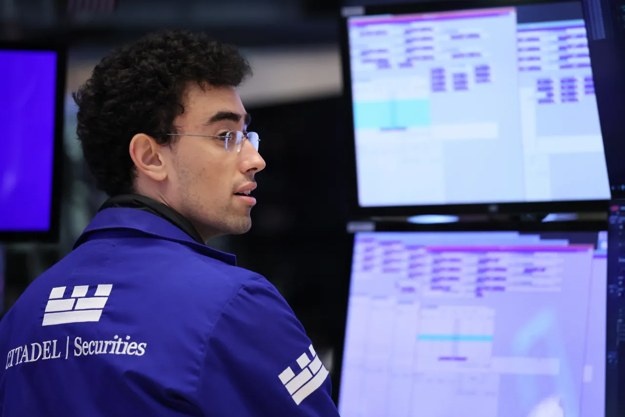 Traders work on the floor of the New York Stock Exchange during morning trading on September 17, 2025, in New York City. 