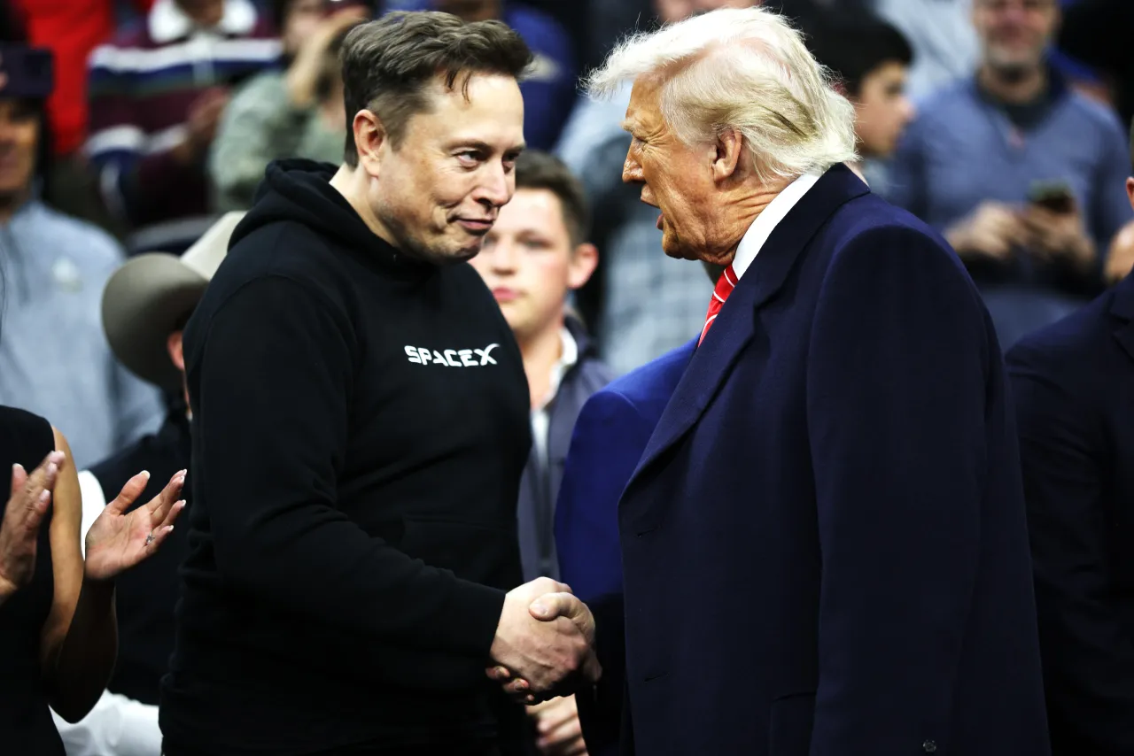 President Donald Trump and White House Senior Advisor, Tesla and SpaceX CEO Elon Musk shake hands while attending the NCAA Division I Wrestling Championship on March 22, 2025 in Philadelphia, Pennsylvania. 
