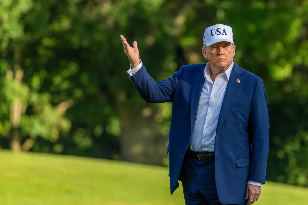U.S. President Donald Trump looks up at the new flag on the south lawn of the White House on July 06, 2025, in Washington, DC. President Trump is returning from a 4th of July weekend in Bedminster. 
