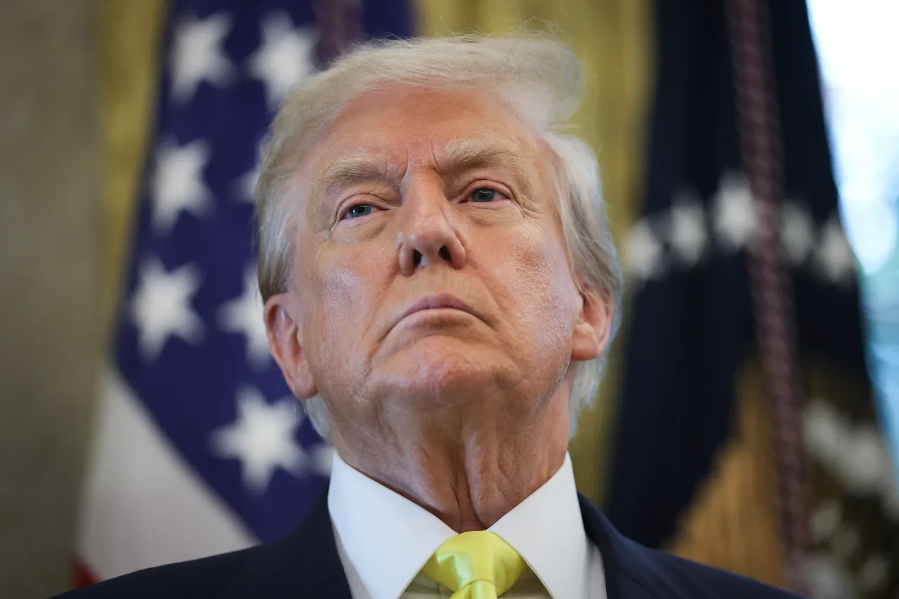 U.S. President Donald Trump listens to questions from reporters after speaking on economic data in the Oval Office on August 07, 2025 in Washington, DC. 
