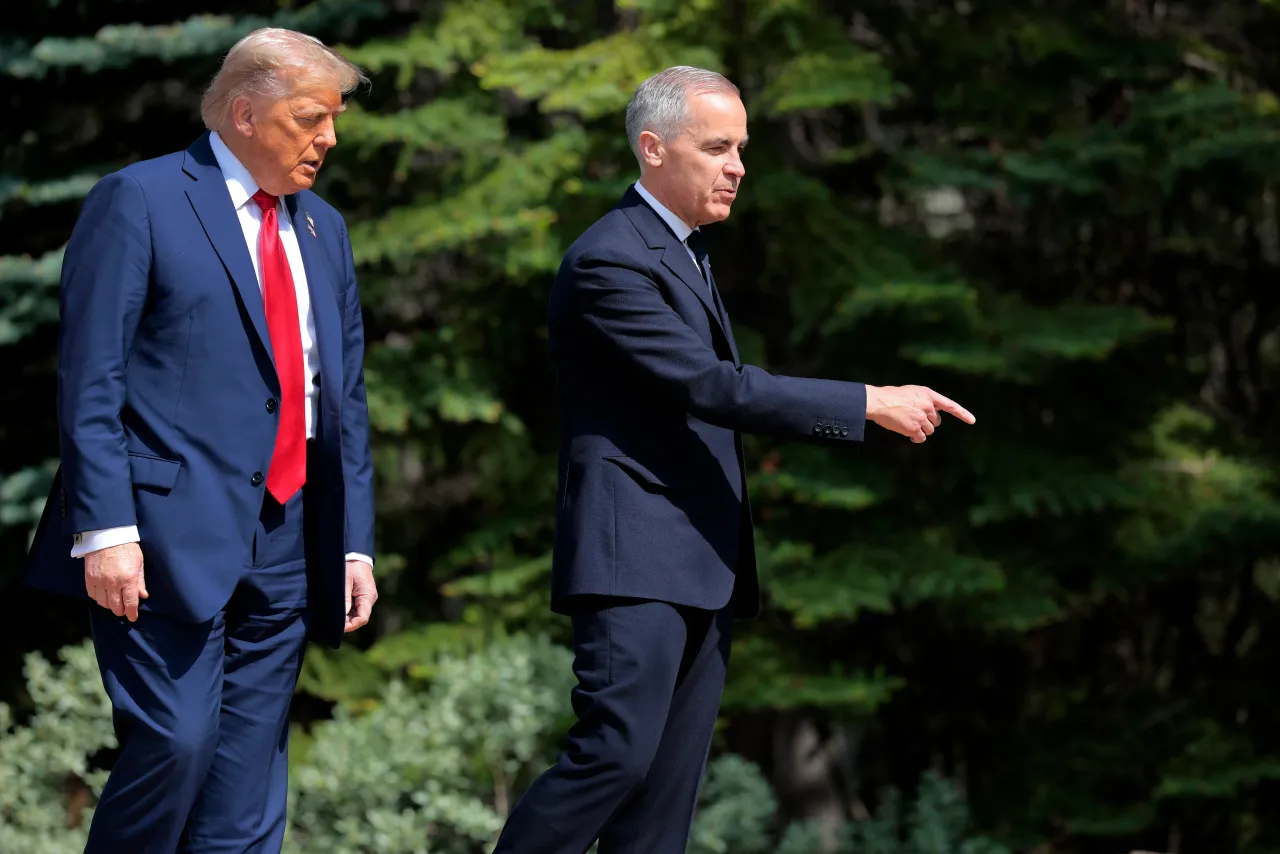 Canadian Prime Minister Mark Carney (R) greets U.S. President Donald Trump at the official welcome ceremony during the G7 Leaders' Summit on June 16, 2025 in Kananaskis, Alberta. 