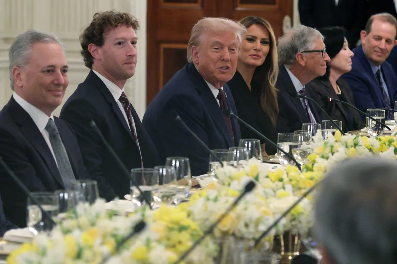 U.S. President Donald Trump speaks as (L-4th L) White House during a dinner he hosted for tech and business leaders at the State Dining Room of the White House on September 4, 2025, in Washington, DC.
