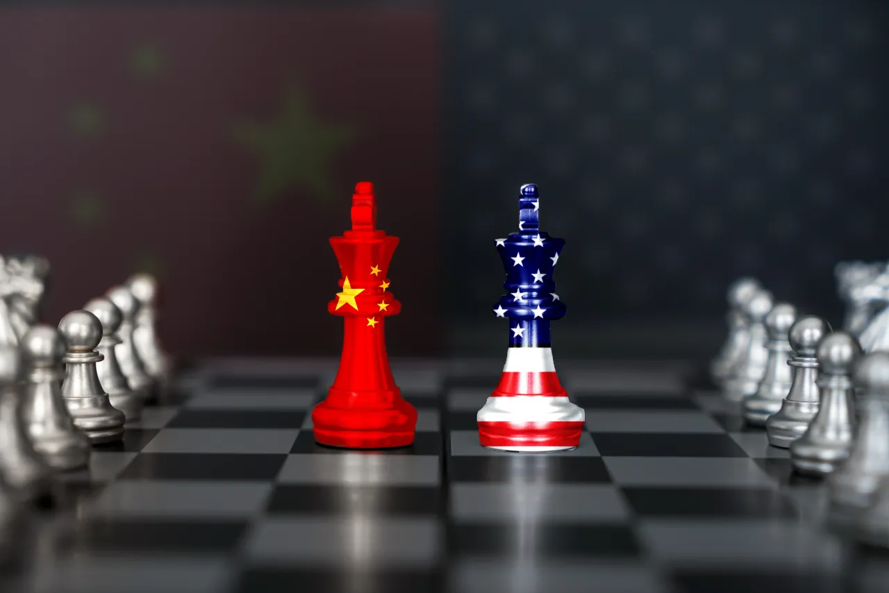 USA and China trade relations, cooperation strategy. American and Chinese flags on a chess king on a chessboard. 