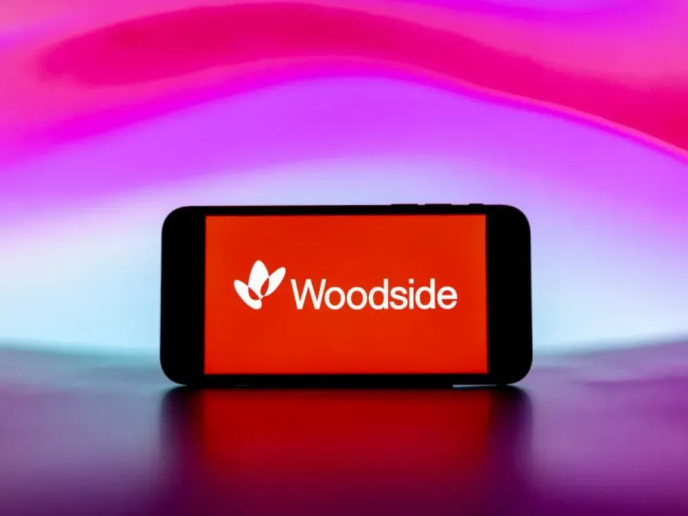 In this photo illustration, the Woodside Energy logo is seen displayed on a mobile phone screen. (Photo Illustration by Idrees Abbas/SOPA Images/LightRocket via Getty Images)